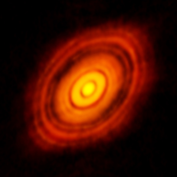 [图片说明]：金牛HL原行星盘的图像。有行星正在这些盘缝中形成？